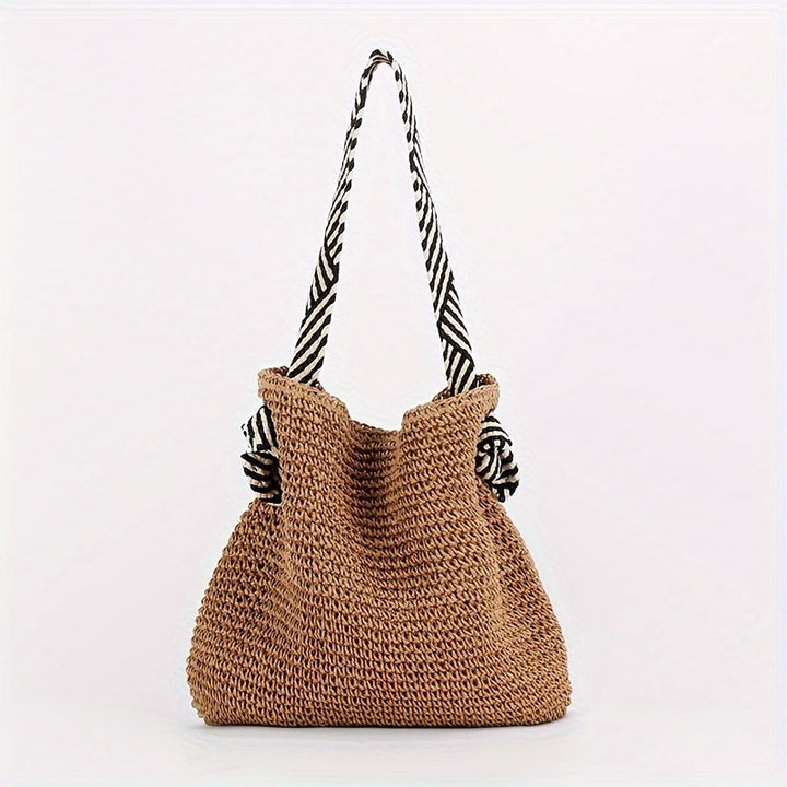 BIRTE - GEFLOCHTENE TASCHE MIT GRIFFEN